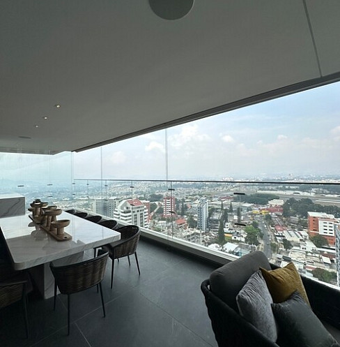 Penthouse terrace with automated shading and panoramic city views