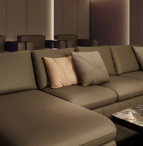 Close view of flexible modular media room seating beneath vertical feature lighting