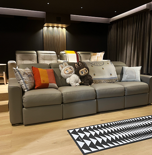 Comfortable cinema seating with soft furnishings, quiet ventilation and acoustic curtains