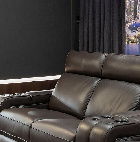 Close view of powered leather cinema recliners with integrated seat controls