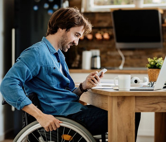 disabled man using smart home control system