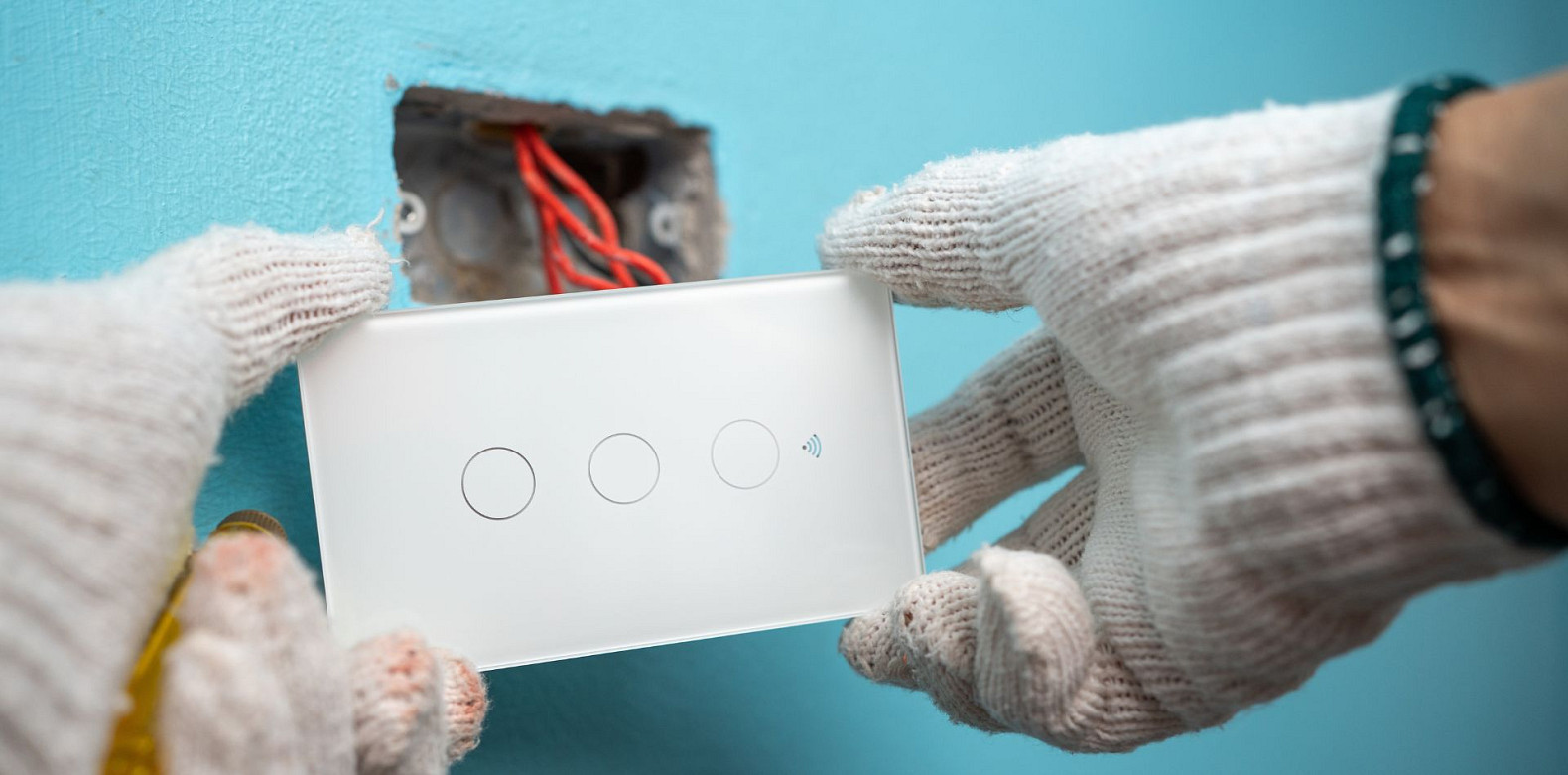 smart home professional installing a smart light switch