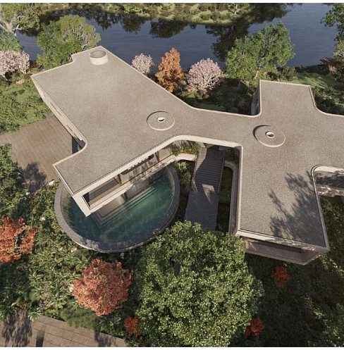 Vista aérea de la vivienda inteligente prefabricada, con arquitectura curva y piscina