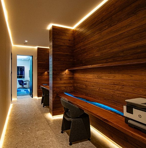Corridor with illuminated timber wall and integrated smart lighting