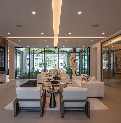 Open-plan living room with centralised lighting, shading and audio