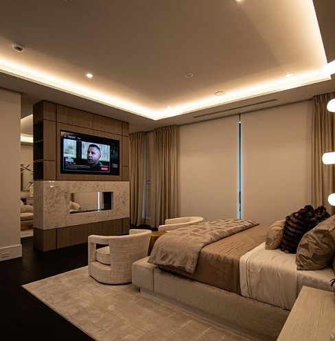 Smart bedroom with integrated television, lighting and window shading