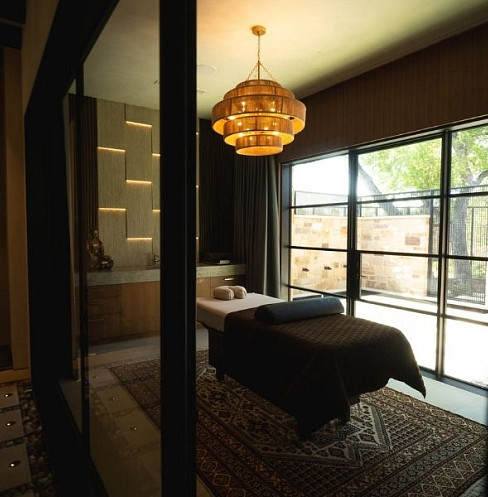 Guest bedroom with automated lighting, shading and integrated audio