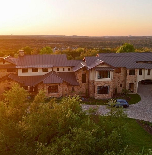 Luxury estate structures unified through multi-building Crestron automation