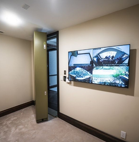 Wall-mounted security display connected to the estate surveillance system