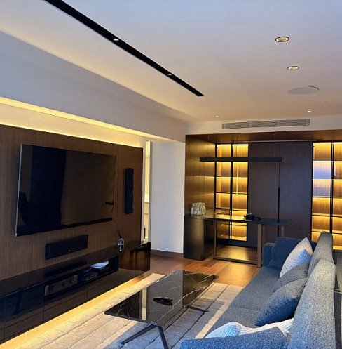 Apartment entertainment wall with integrated television, soundbar and subwoofer