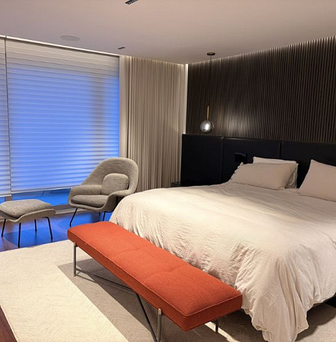 Smart bedroom with integrated lighting, audio and motorised window treatments