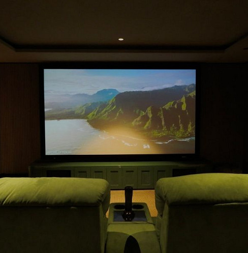 Acoustically transparent cinema screen concealing the front speakers