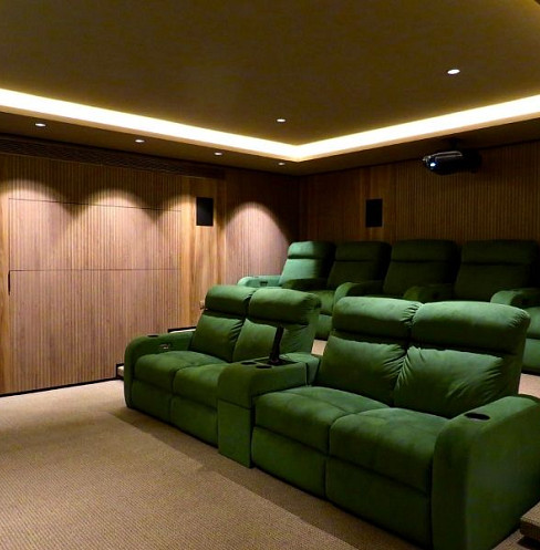 Compact home cinema with hidden speakers and low-profile lighting