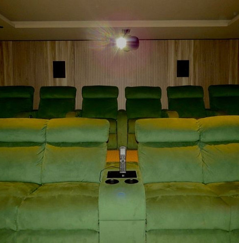 Dolby 7.2 home cinema with tiered green recliner seating