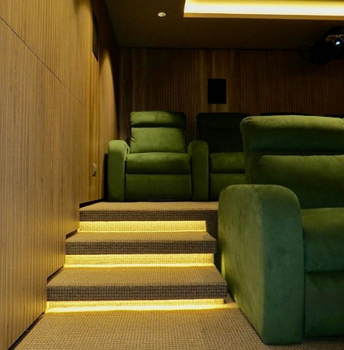 Illuminated cinema steps leading to two rows of seating