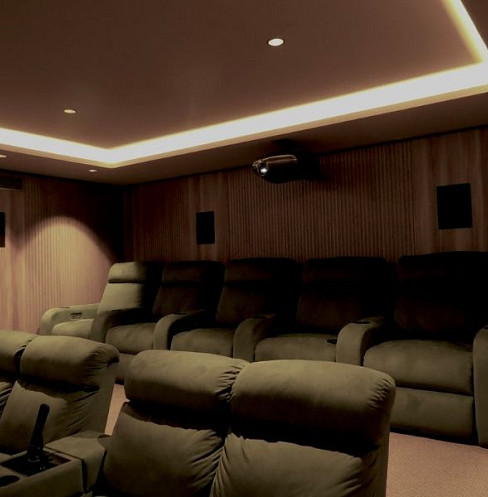 Two-row basement cinema with all speakers installed invisibly in the walls