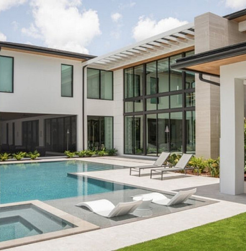 Covered outdoor lounge with distributed audio and pool controls