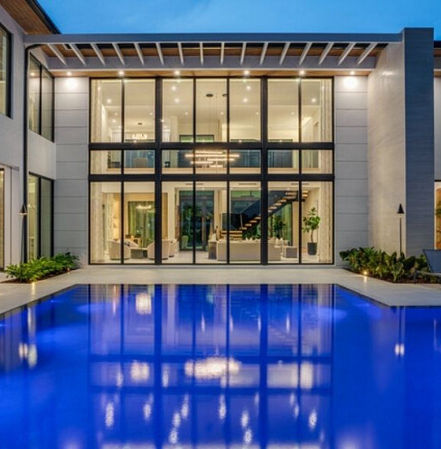 Modern smart home and swimming pool with integrated outdoor technology