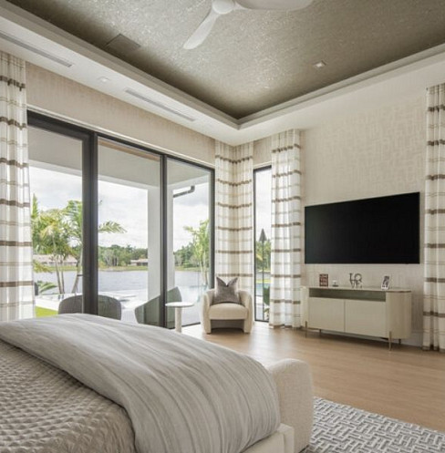 Smart bedroom with concealed audio, shading and television
