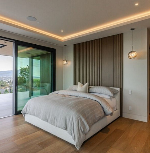 Bedroom with Crestron lighting scenes and motorised window shading