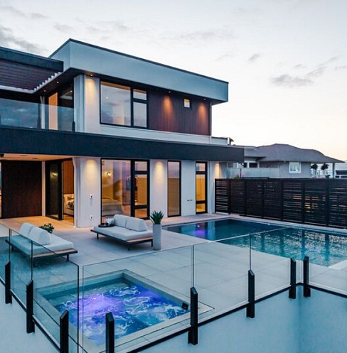 Coastal residence exterior with automated lighting and remote monitoring
