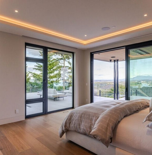 Smart bedroom with motorised shading and concealed ceiling speakers